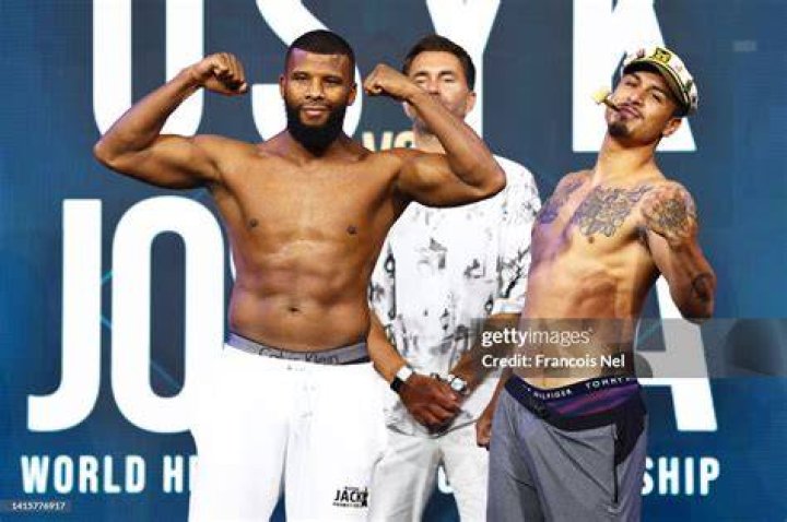 Badou Jack giving a pose in his boxing costume.