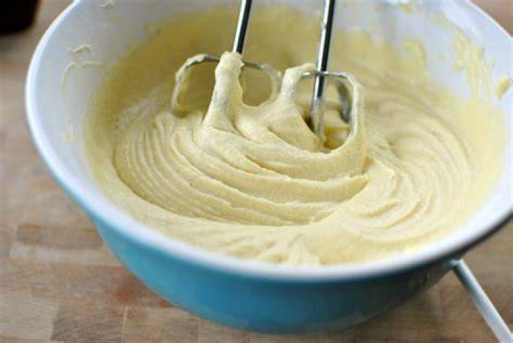 Cake batter in a large bowl for Apple Cider Donut Cake