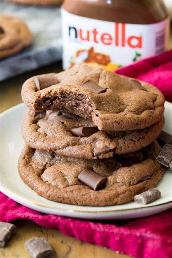 Two pieces of nutella cookie bars stacked on top of each other.